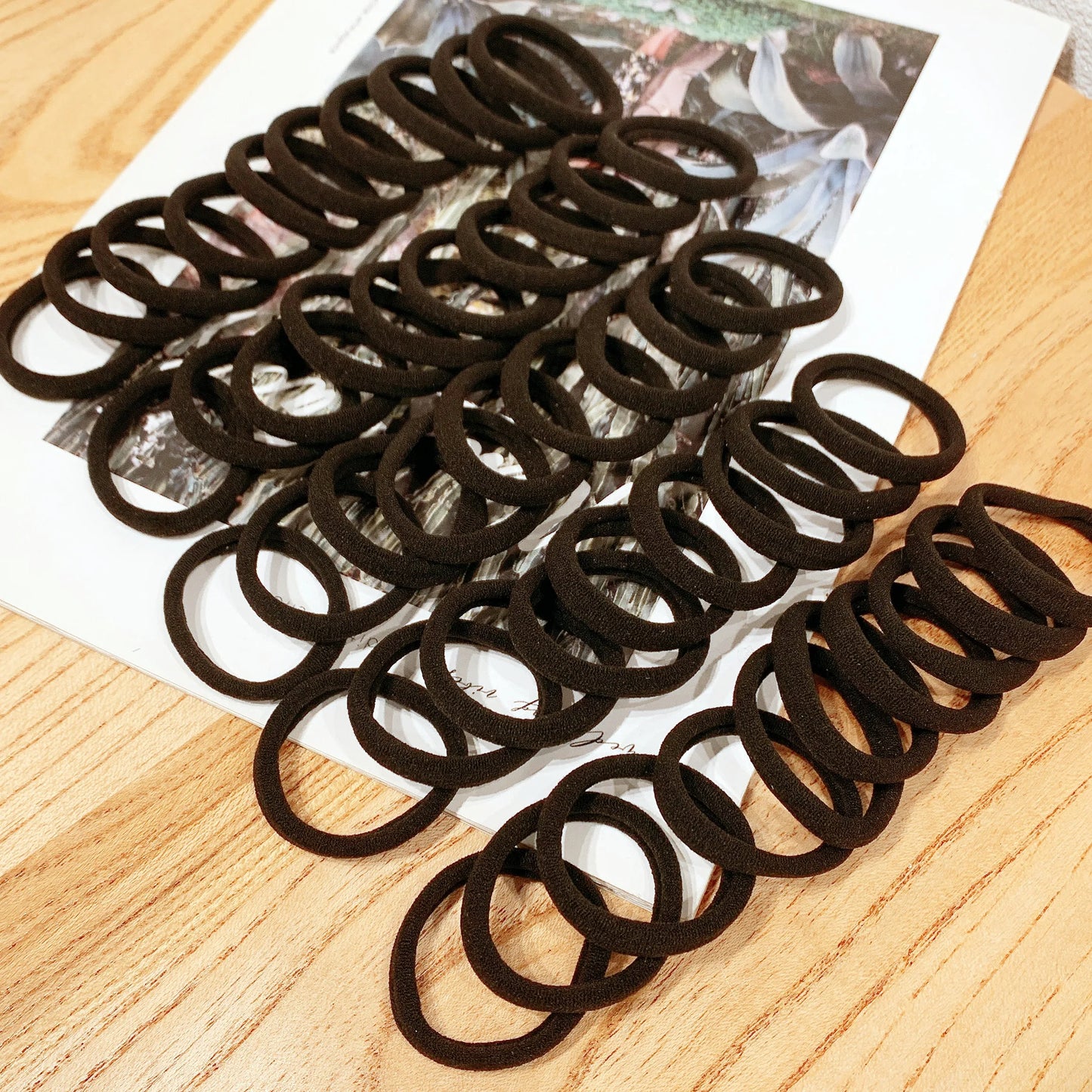 Unleash Your Style with 50/100PCS High Elastic Black Hair Bands!